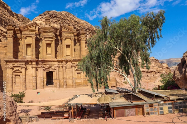 Fototapeta Petra, Jordan : ancient Monastery building in Petra (Ad Deir) with trees / one of the Seven Wonders of the World (historical place in Arab countries)