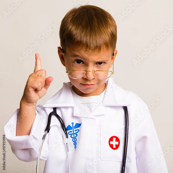 Obraz Portrait of a child with glasses and a suit doctor
