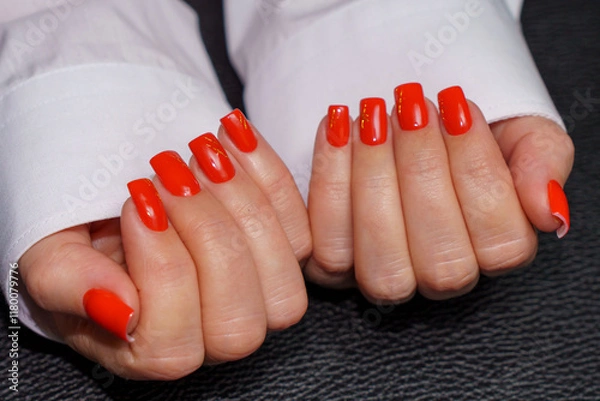 Obraz women's hands with red manicure