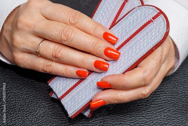 Obraz women's hands with red manicure