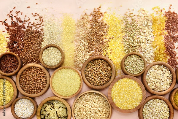 Fototapeta Colorful mix of grain varieties: oat and wheat, rice and millet, buckwheat and barley, quinoa and polenta. Food ingridients for healthy diet background, selective focus