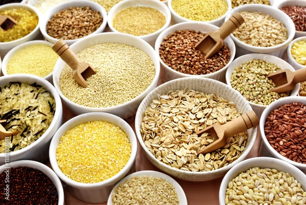 Fototapeta Colorful mix of grain varieties: oat and wheat, rice and millet, buckwheat and barley, quinoa and polenta. Food ingridients for healthy diet background, selective focus