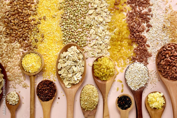 Fototapeta Colorful mix of grain varieties: oat and wheat, rice and millet, buckwheat and barley, quinoa and polenta. Food ingridients for healthy diet background, selective focus