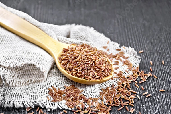 Obraz Rice red in spoon on board