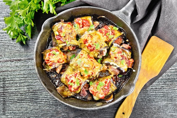 Obraz Rolls of eggplant with meat in pan on board top