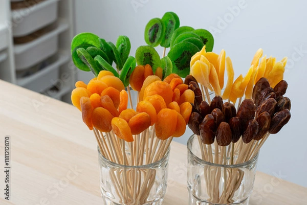 Fototapeta Assorted Dried Fruits on Skewers in Glass Cups