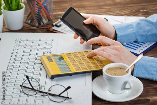 Obraz Hands close-up at the office in the composition of objects for business