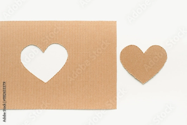 Fototapeta Cardboard heart. Cut out heart on cardboard. Valentine's Day background. February 14. Heart on a white background.