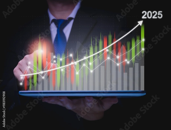Obraz Business goals trends 2025 businessman showing virtual hologram stocks growing on hand
