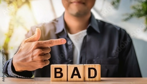 Obraz BADの英語の文字が書かれた木製のキューブブロック。aiで生成	