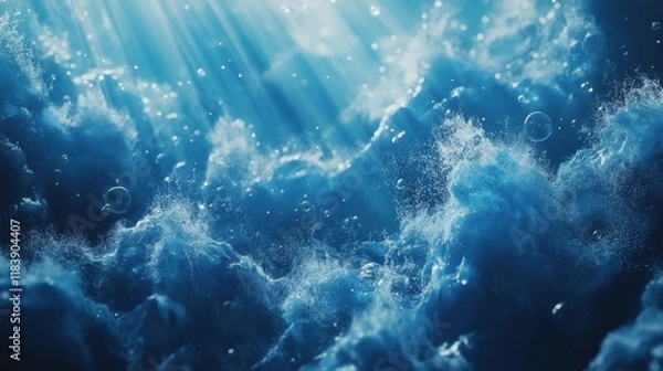 Fototapeta Blue ocean waves from underwater with bubbles. Light rays shining through. Great for backgrounds.