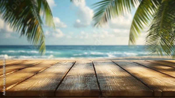 Fototapeta A wooden table with an ocean view and palm trees in the background, depicting a summer vacation concept, with copy space for displaying products in a montage