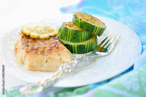 Obraz Grilled fish (cod) with zucchini.