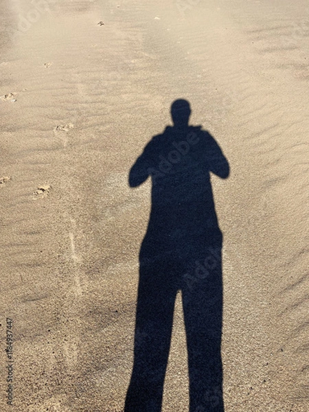Fototapeta selfie shadow of a person on the sand