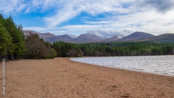 Fototapeta Sandy beach by a calm lake in Scotland, UK, captured on 2024-11-02.