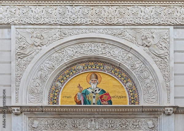 Fototapeta Detail of the front gable of the Serbian orthodox Saint Spyridon church with rich coloured mosaic and refined sculptures in Trieste, Italy