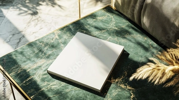 Fototapeta Blank square book mockup on green marble table.