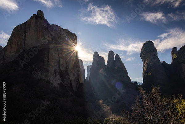 Fototapeta The mountains of Meteora. Amazing landscape with the cliffs and rocks from Meteora during a day with blue wky and spectacular clouds. Travel to Greece.