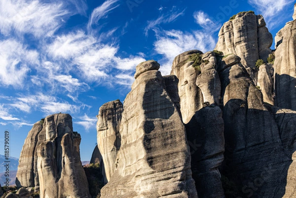 Fototapeta The mountains of Meteora. Amazing landscape with the cliffs and rocks from Meteora during a day with blue wky and spectacular clouds. Travel to Greece.