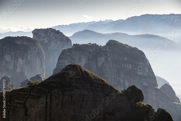 Fototapeta The mountains of Meteora. Amazing landscape with the cliffs and rocks from Meteora during a day with blue wky and spectacular clouds. Travel to Greece.