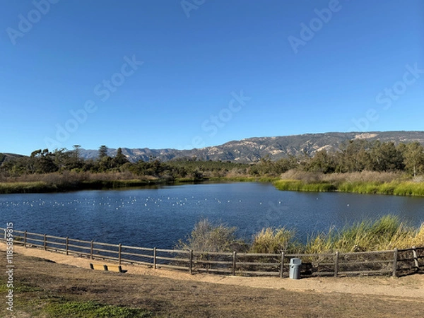 Obraz Tranquil Lake Carneros in Goleta with Santa Ynez mountains in the back on a warm southern Caliornia winter day