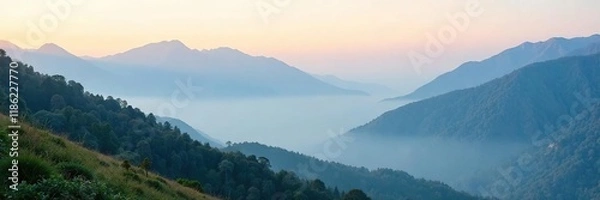 Fototapeta Morning mist clings to mountain slopes and peaks, fog, gentle,