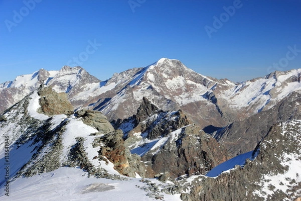 Fototapeta View from Mittelallalin Station. Overlooking glaciers and the highest peaks of the Swiss Alps.