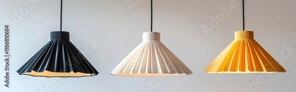 Obraz Three pendant lights with pleated lampshades in different colors, Scandinavian-style on white background.