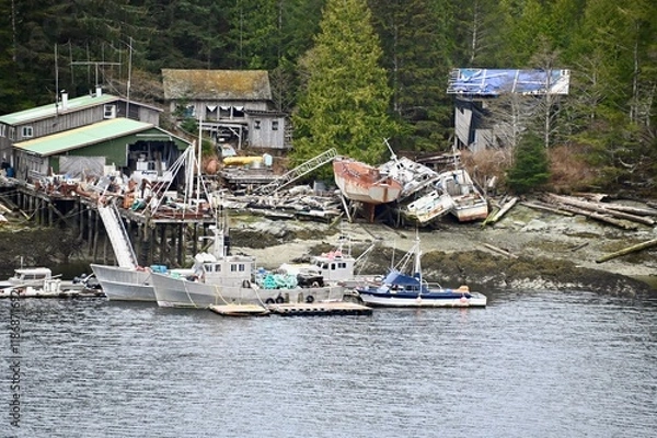 Fototapeta 






















two commercial fishing boats are tied to a dock surrounded by the damage left by a major wind storm in 2021