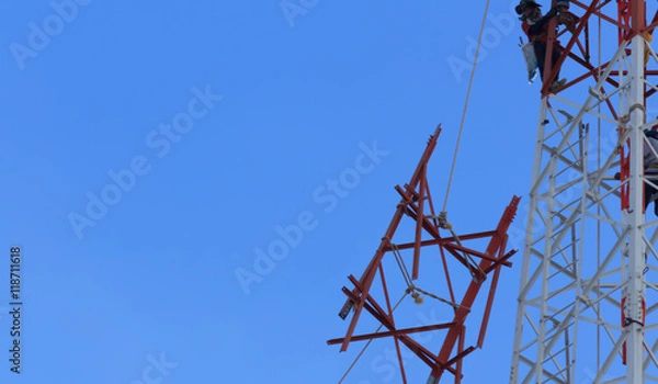 Fototapeta Technicians was dismantled tower the phone is due to complaints about the health of the people.