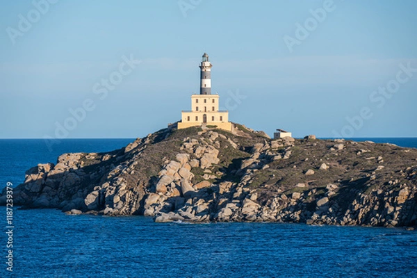 Fototapeta The lighthouse overlooking the cliffs of Isola dei Cavoli in Villasimius