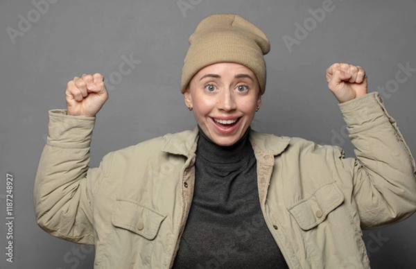 Fototapeta feeling happy, satisfied and powerful, flexing fit and muscular biceps, looking strong after the gym
