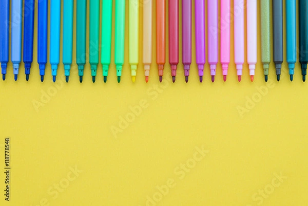 Fototapeta Colorful pen on yellow background with copy space - Creative idea and education concept.