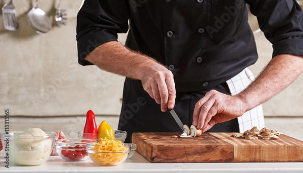 Fototapeta Restuarant hotel private chef cutting mushrooms on board