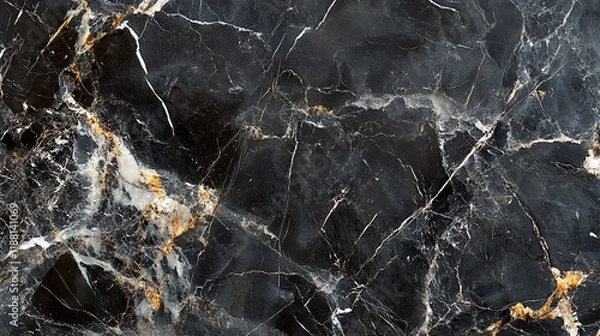 Fototapeta Close-up of black marble with gold and white veining.
