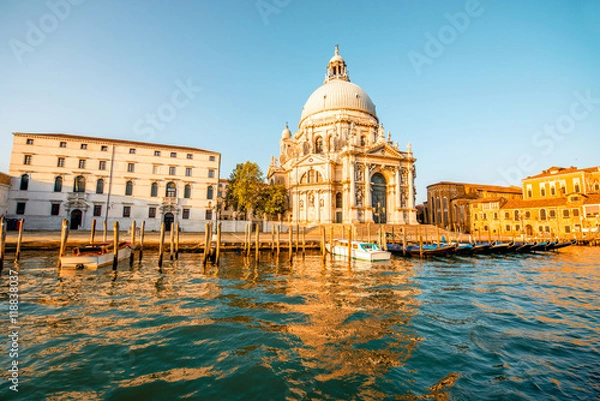 Fototapeta Beautiful waterfront with gothic buildings and Santa Maria basilica on the Grand canal at the morning in Venice