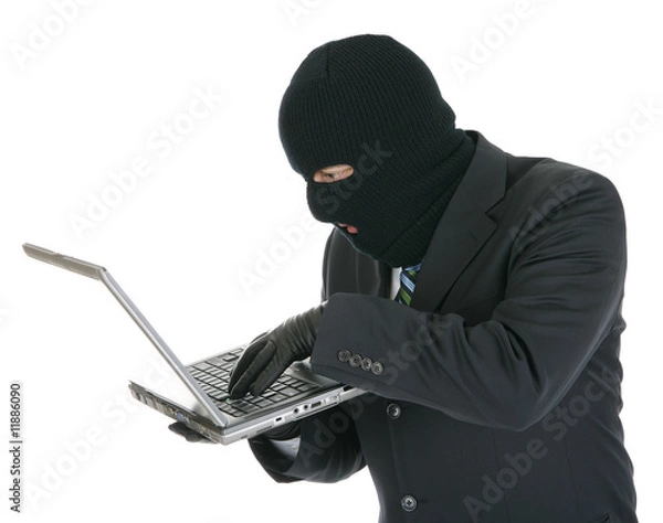 Fototapeta Computer criminal - Hacker with laptop computer
