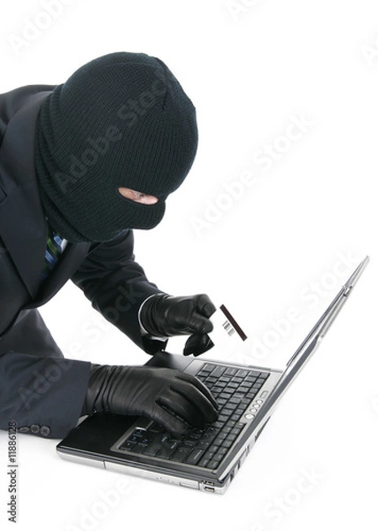 Fototapeta Computer criminal - Hacker with laptop computer