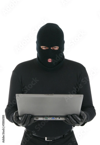 Fototapeta Computer criminal - Hacker with laptop computer
