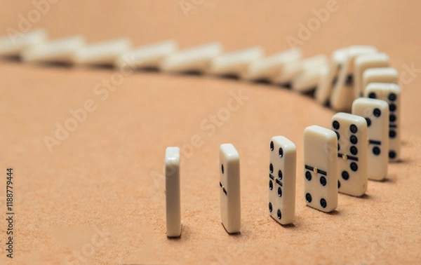 Fototapeta domino pieces lined up falling sequentially.