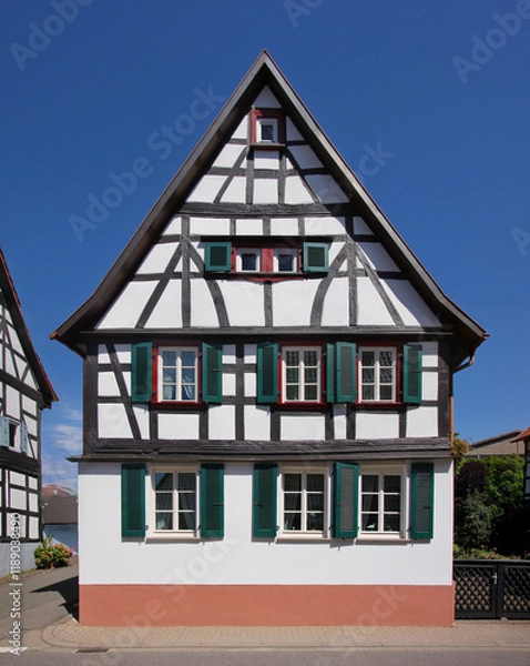 Obraz Half-timbered wooden residential house with symmetrical gable in Germany