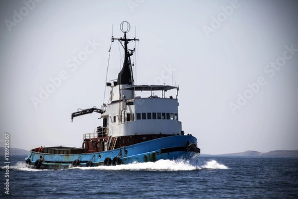 Fototapeta Rusty fishing vessel on the sea