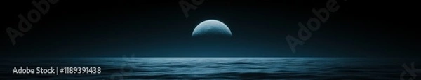 Fototapeta Soft blue light illuminates ocean waves under a crescent moon at twilight