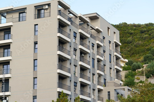 Fototapeta Modern apartment building in Mediterranean style in Albania on the sea coast. Concept of selling a house abroad, renting apartments