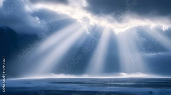 Fototapeta Dramatic sun rays breaking through dark clouds over ocean.