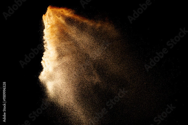 Fototapeta Sand flying explosion isolated on black background ,throwing freeze stop motion object design.