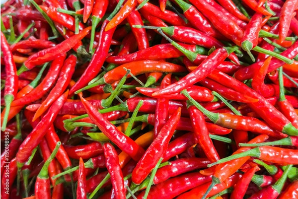 Obraz Vibrant heap of ripe red chili peppers, essence of spicy cuisine, fiery flavor of Capsicum annuum. Closeup of fresh chilies essential gourmet cooking ingredient in any healthy kitchen.