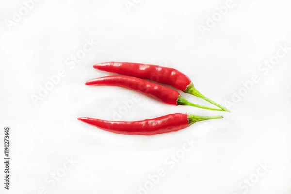 Fototapeta red cayenne pepper pods on white isolated background