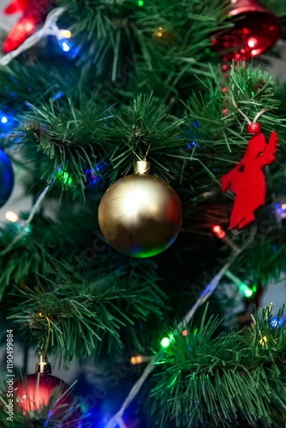 Obraz Christmas toys on an artificial Christmas tree close-up