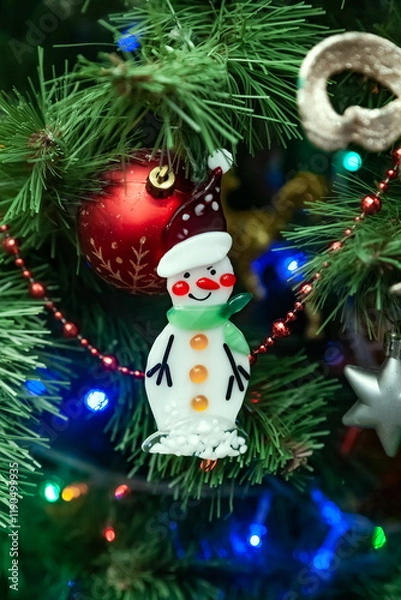 Obraz Christmas toys on an artificial Christmas tree close-up